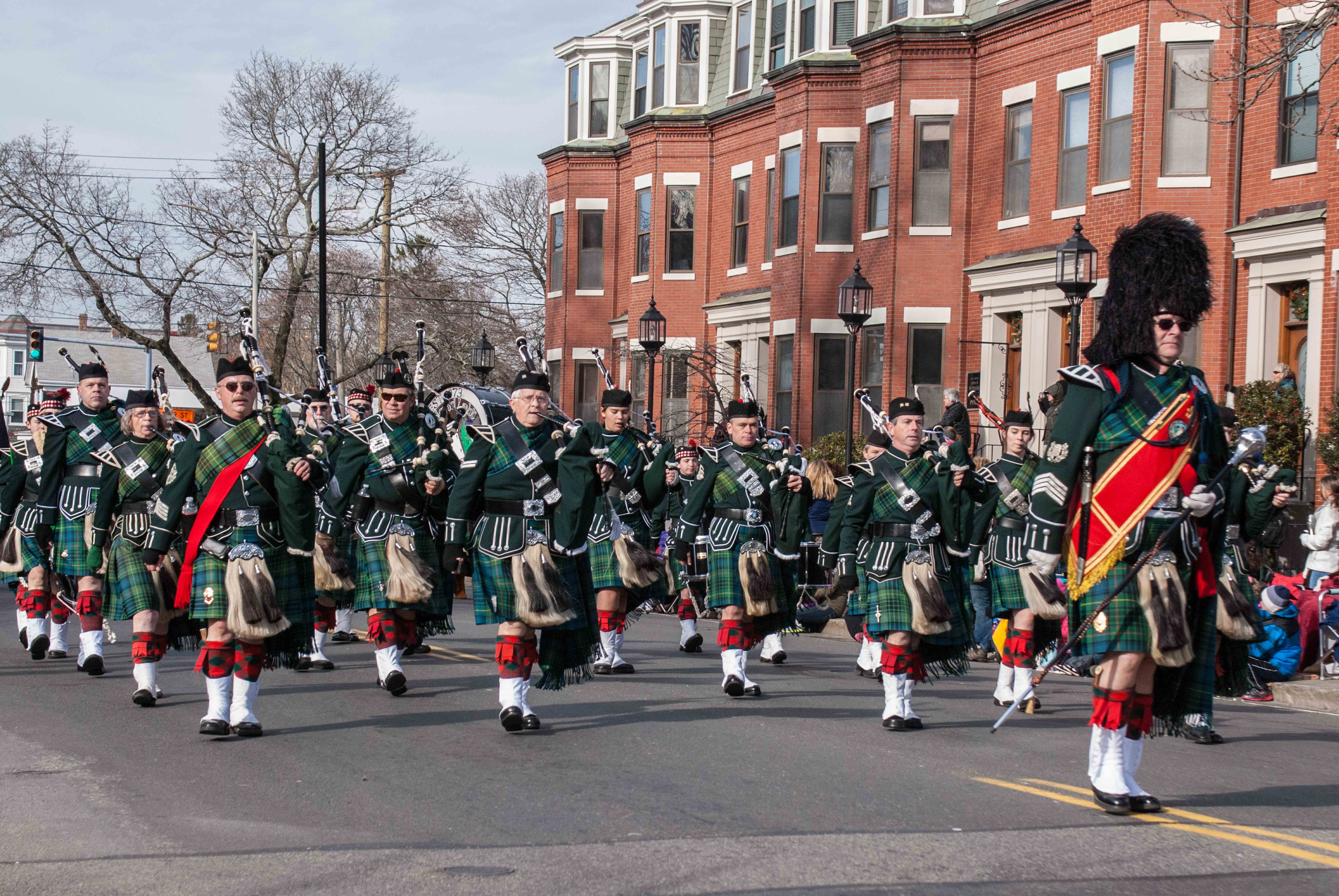 The band wearing the traditional dress uniform of the Highland Light Infantry, marching in the Plymouth Thanksgiving parade.